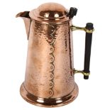 HENRY LOVERIDGE - an Arts and Crafts hammered copper jug after a Christopher Dresser design, with