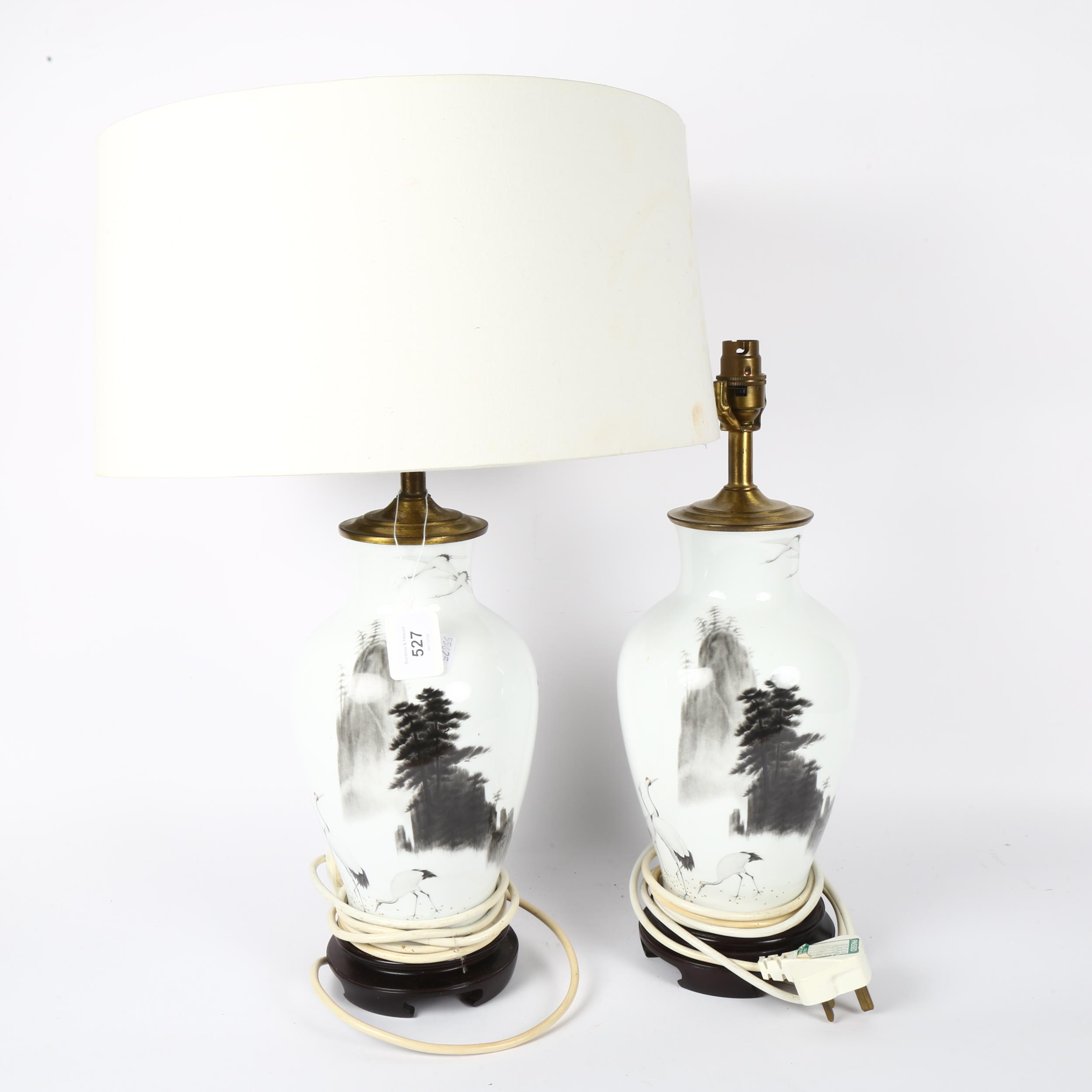 A pair of Japanese porcelain table lamps, with design of mountains and cranes, with matching white - Image 2 of 2