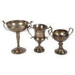 3 various 2-handled silver trophies, 1 with dog's head mounts, tallest with hallmarks London 1936,