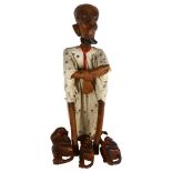 A wooden carved African figure, and a group of hanging monkeys, largest height 73cm