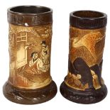 A pair of Bretby stoneware vases with Oriental and heron decoration, largest 24cm