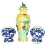 A pair of Antique Chinese blue and white vases with prunus decoration, height 11cm, and a yellow