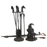 A fire companion set with horse head finials, a walking stick, Mr Punch doorstop etc