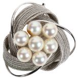 A stylised woven and scrolled pearl set silver pendant/brooch, width 40mm
