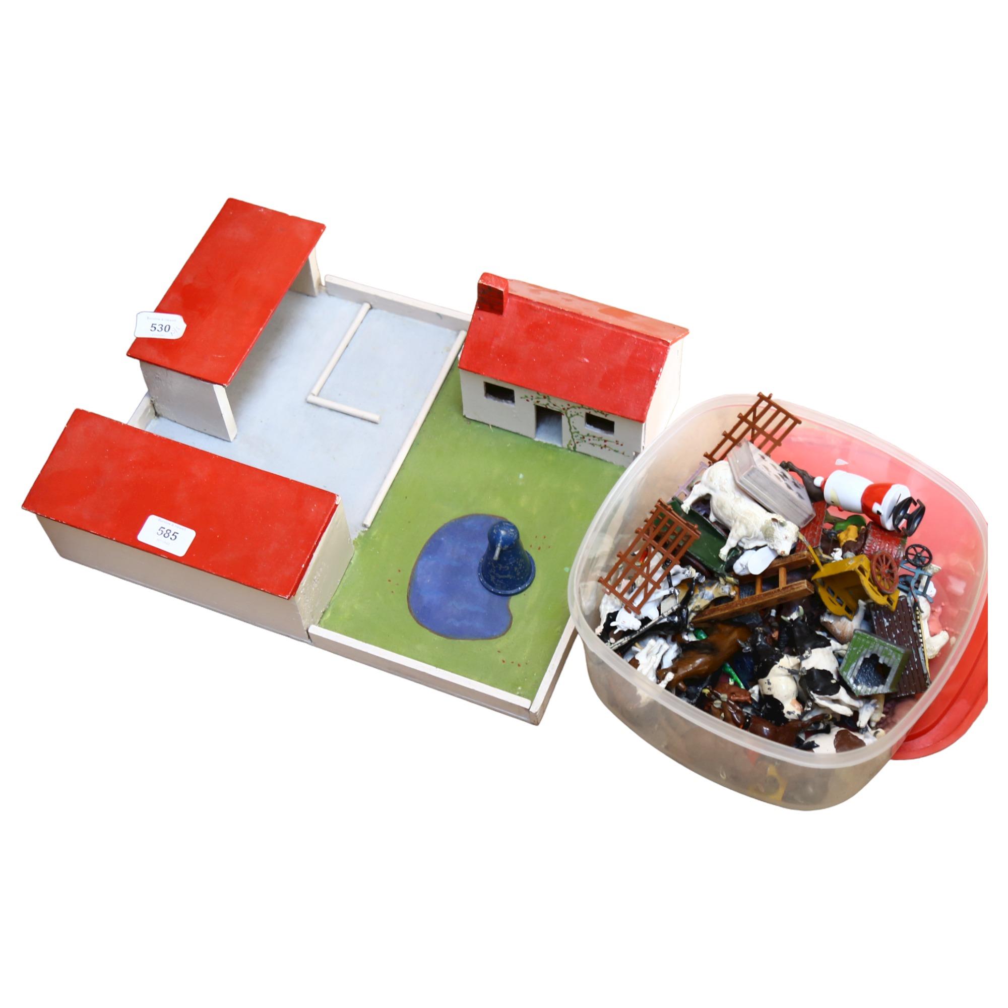 A Vintage handmade toy farmyard, and a quantity of diecast and plastic animals and accessories