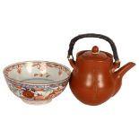 A Chinese Yixing teapot with incised decoration, and a small 19th century bowl, diameter 15cm Teapot
