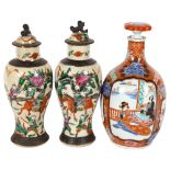 A Japanese porcelain bottle and stopper, with hand painted decoration, 6 character mark, height