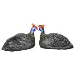 A pair of plaster, hand painted guinea fowl