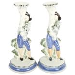 A pair of Rye Pottery candlesticks with figure supports, 26.5cm