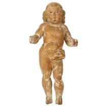 A 19th century carved wood figure of a child, with traces of original paints, with hanging hook to