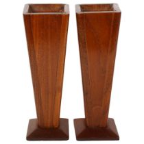A pair of Arts and Crafts style mahogany vases of tapered form, height 27cm