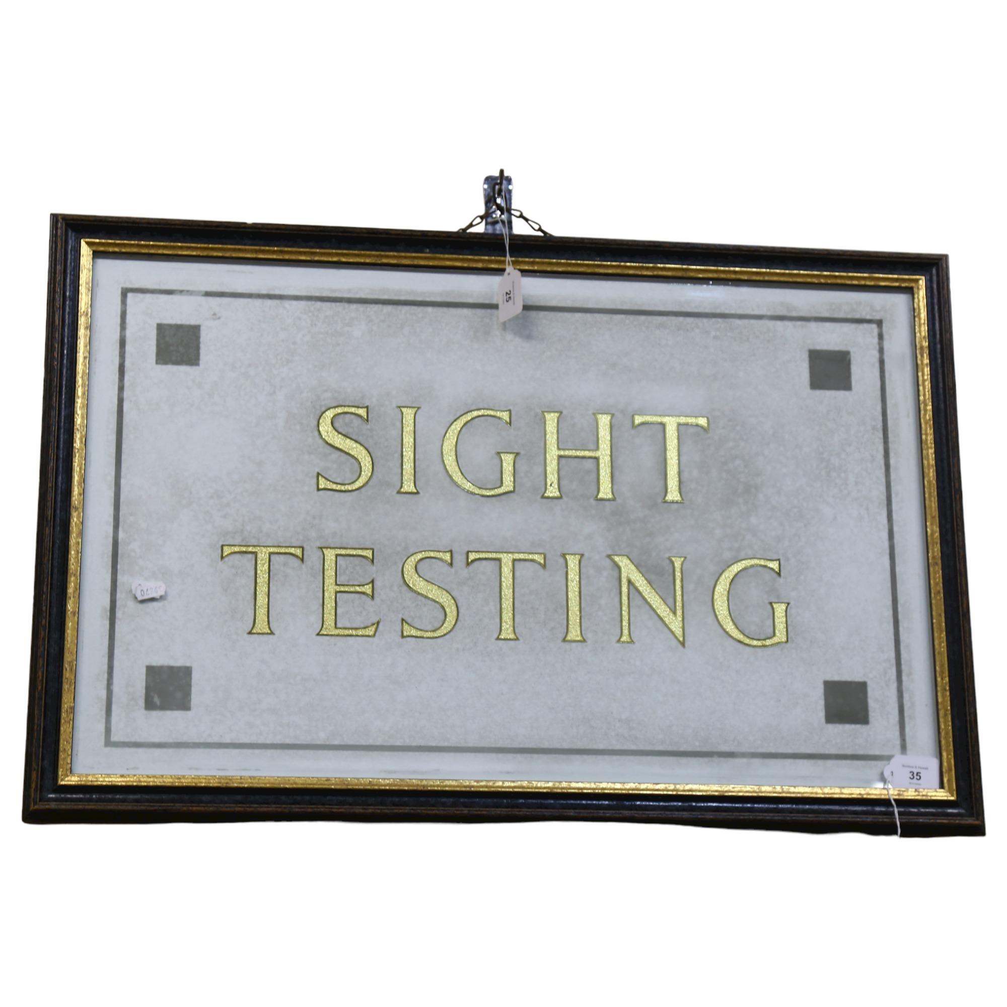 A gilded glass Optician's Testing sign, framed, overall 53cm x 80cm Good condition, no obvious