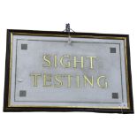 A gilded glass Optician's Testing sign, framed, overall 53cm x 80cm Good condition, no obvious