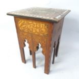 A Moorish hardwood square topped occasional table with carved and inlaid mother of pearl decoration,