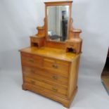 An Edwardian satinwood dressing chest with raised mirrored back, two short and two long drawers,