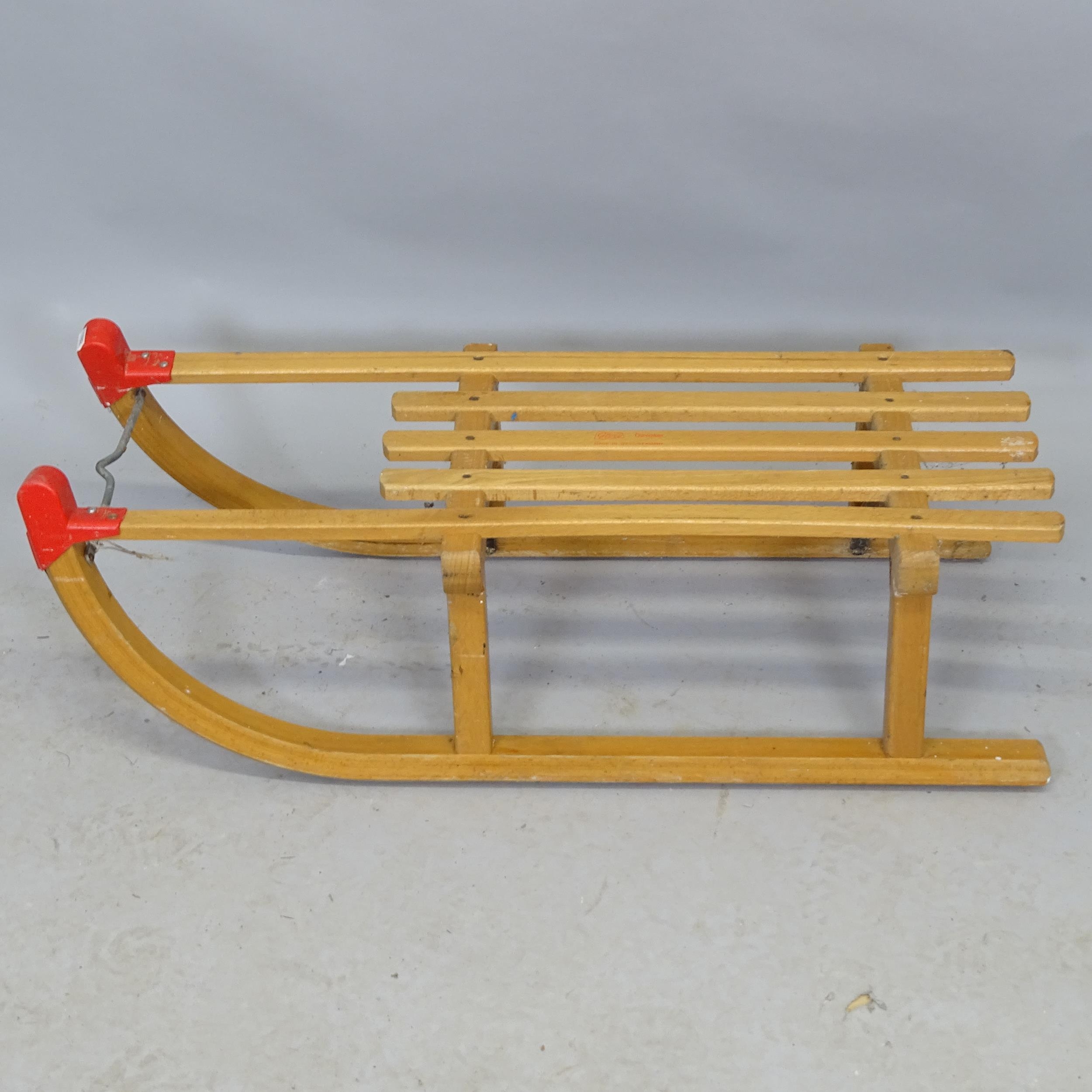 A vintage child's sledge. 79cm x 24cm x 30cm