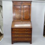 A 18th century oak 3-section bureau bookcase, the fall-front revealing a fitted interior with 4 long