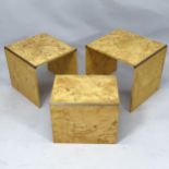 A 1970s French nest of three occasional tables in burr elm with brass detail in the manner of Jean-