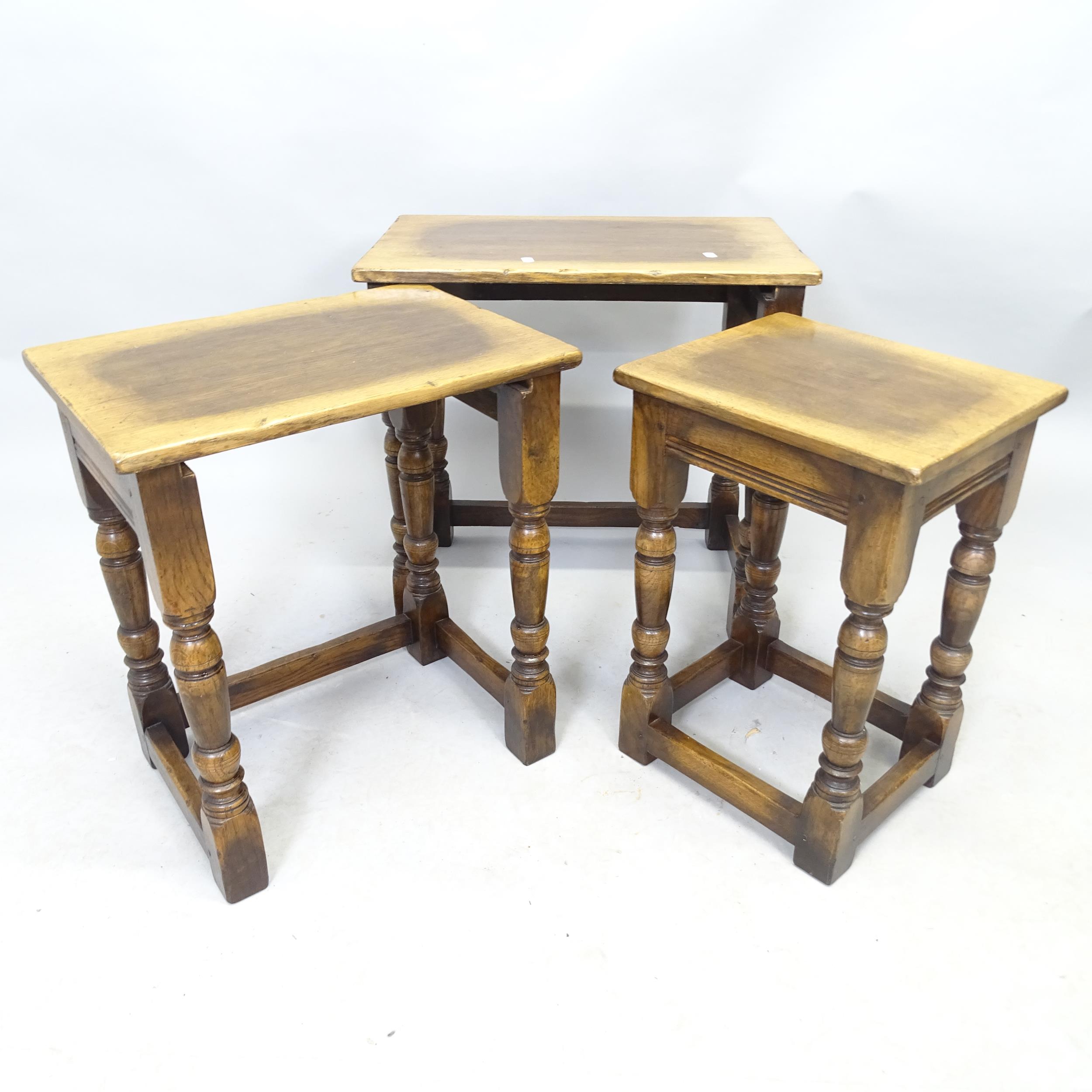 An Ipswich Oak design nest of three occasional tables. Largest 53cm x 50cm x 36cm