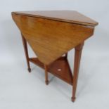 An oak Arts and Crafts style 2-tier corner drop-leaf occasional table, on square tapered legs with