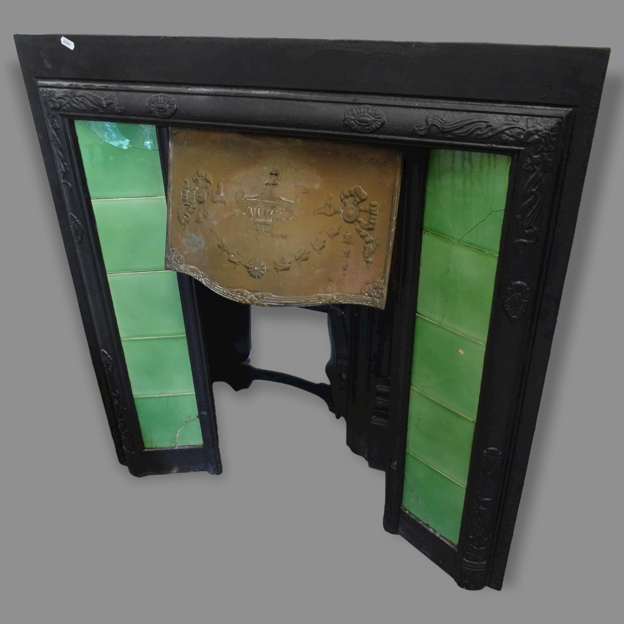 An Antique cast-iron fire surround, with tiled panels and brass hood, 91cm x 97cm, and another