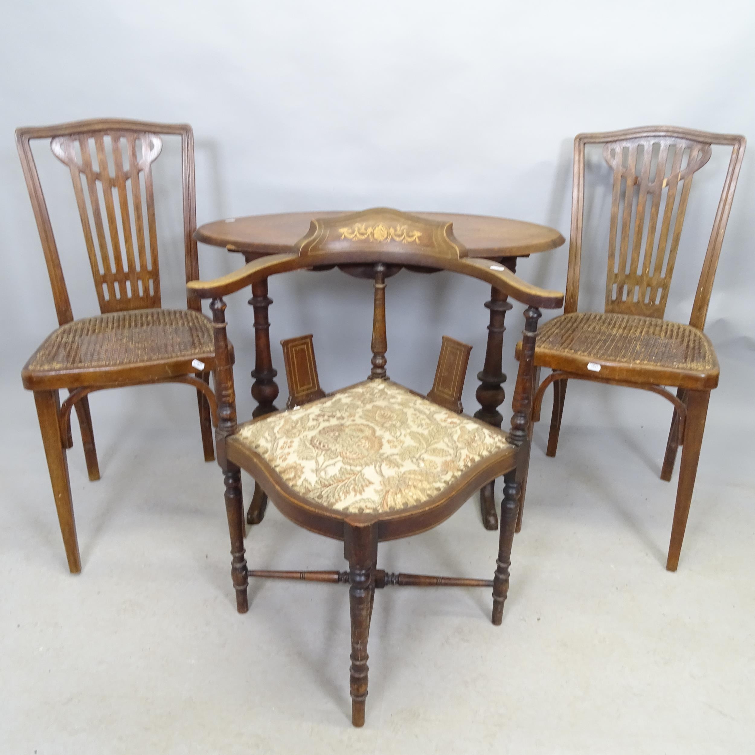 A pair of early 20th century mahogany cane seated dining chairs with bentwood stretchers, a corner