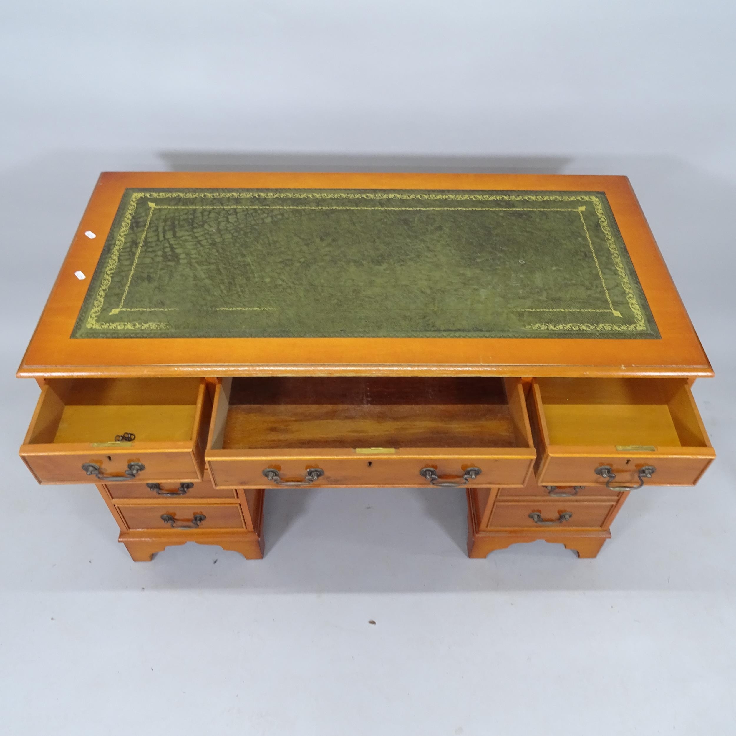 A modern yew wood twin-pedestal writing desk, with tooled and embossed leather skiver and 9 fitted - Image 2 of 2