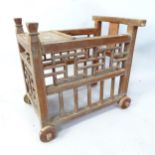 A Chinese elm child's walker/trolley. 60cm x 54cm x 44cm