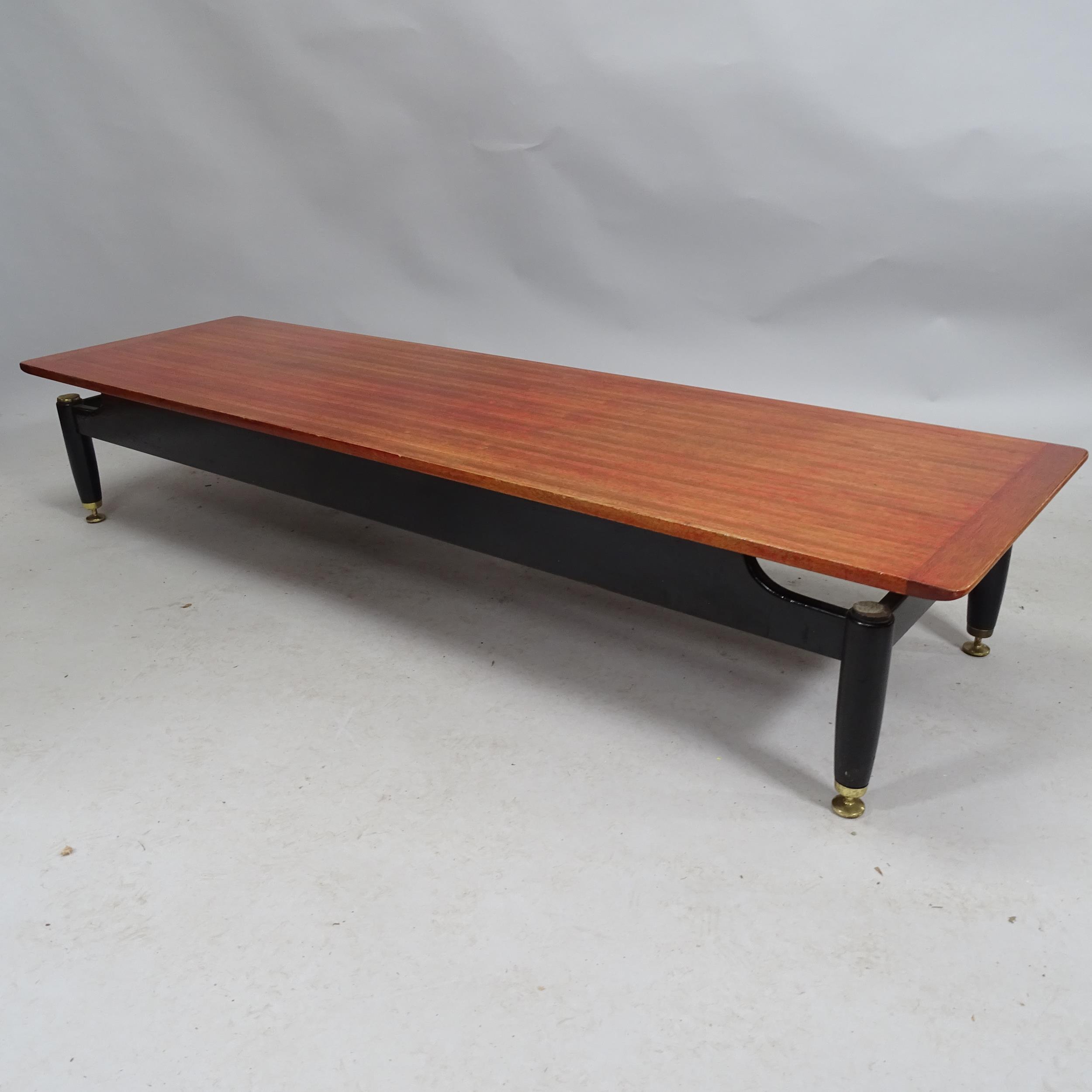 A mid-century G-plan Librenza long Tom coffee table in teak with black painted base. 1689cm x 30cm x