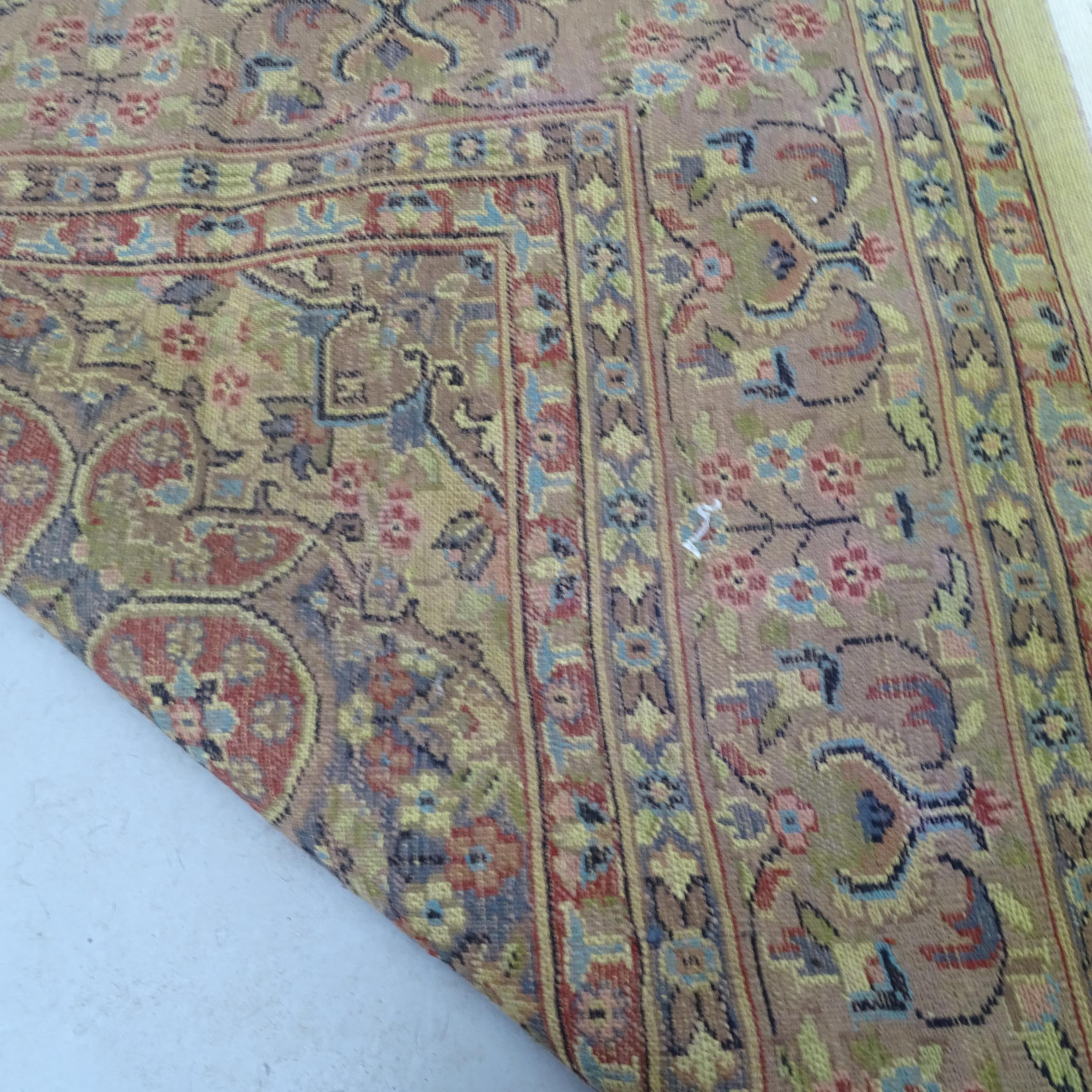 A red and cream ground Iranian Tabriz carpet with symmetrical floral decoration. 270cm x 175cm - Image 2 of 2