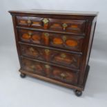 A Jacobean oak chest of 4 long drawers on bun feet. 100 x 100 x 59cm.