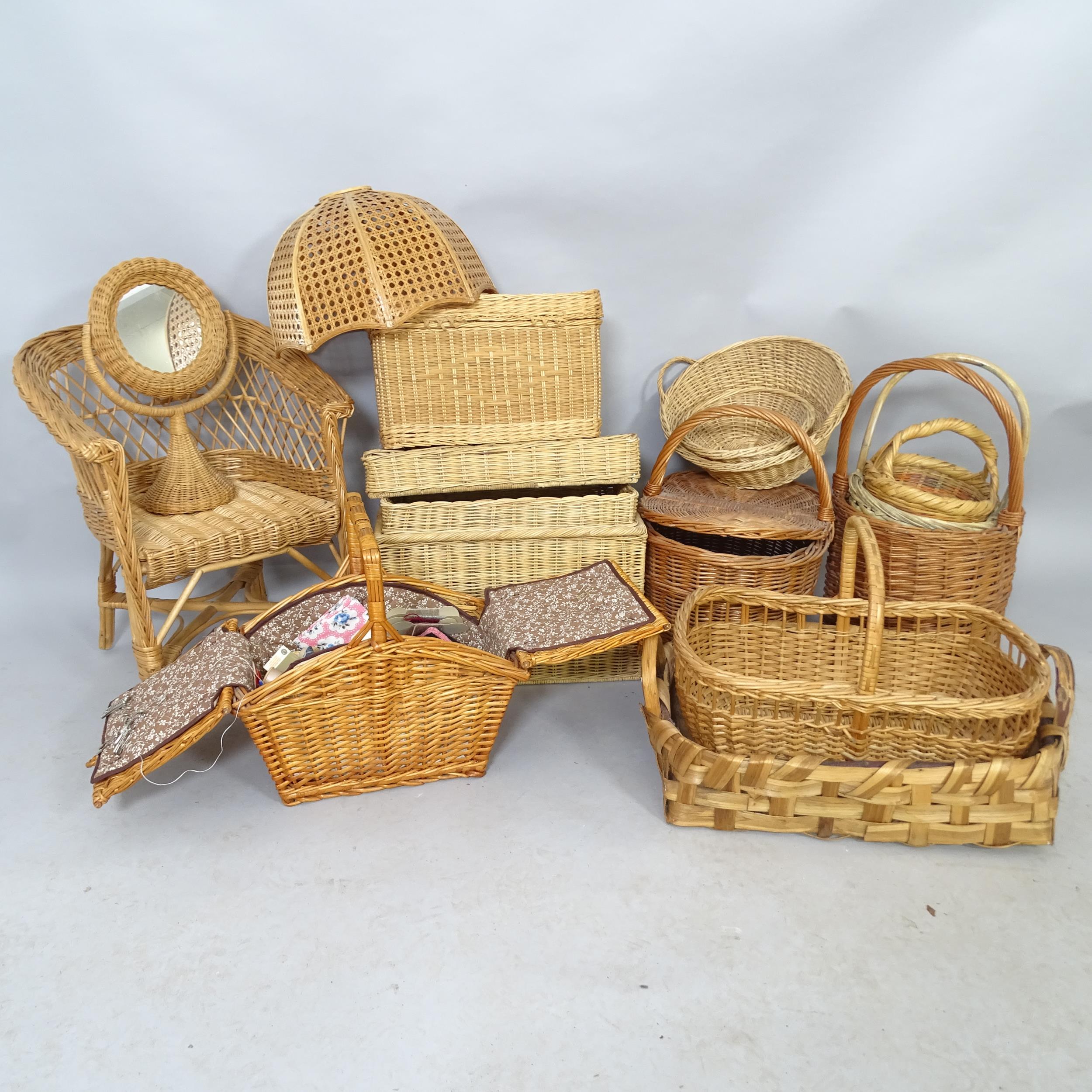Various wicker baskets including a sewing basket and contents, a mirror, a child's chair etc.