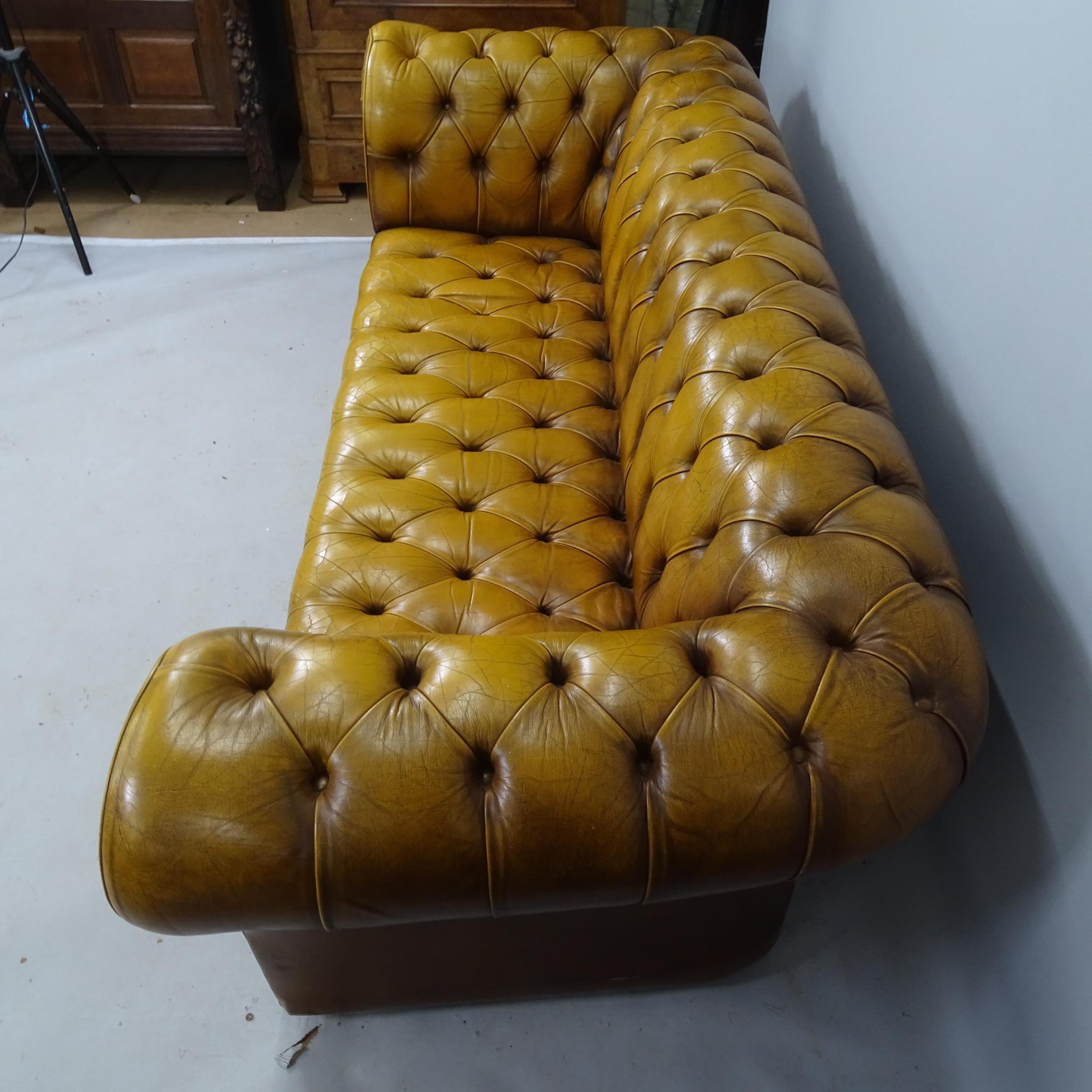 A buttoned brown leather-upholstered Chesterfield sofa, 200 x 80 x 85cm - Image 2 of 2