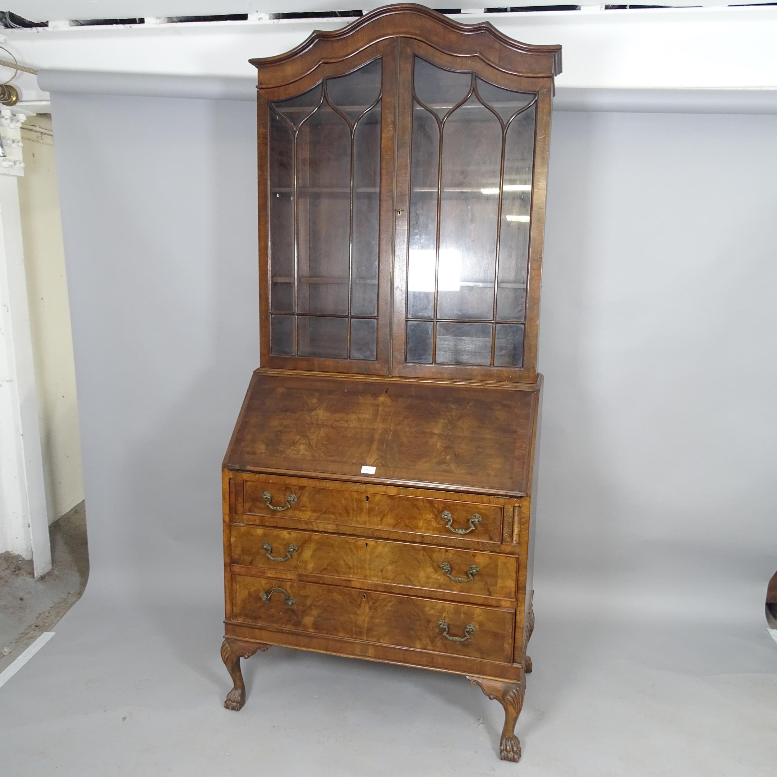 A 19th century mahogany two-section bureau bookcase, the fall-front revealing a fitted interior with