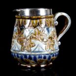 Francis E Lee for Doulton Lambeth, a small stoneware cream jug, with incised decoration and silver