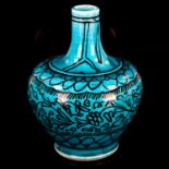 A Middle Eastern Iznik turquoise glaze ceramic narrow-neck vase, with hand painted decoration,