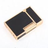 DUPONT - a gold plated and black enamel pocket lighter, length 5.5cm