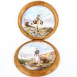 A pair of large 19th century French ceramic wall plates, with hand painted designs of fisher