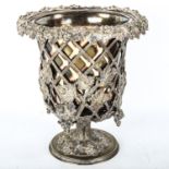 An ornate electroplate wine cooler, with relief cast grapevine and lattice surround, height 27cm,