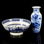 A Worcester tin glazed blue and white pottery bowl, diameter 26cm, and an Oriental blue and white