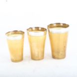 A set of 3 Victorian graduated horn beakers, with silver rims, by Thornhill of London, largest