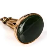 A 9ct rose gold jadeite seal fob, set with oval cabochon jadeite and relief embossed floral
