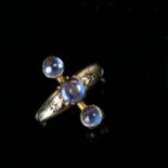 A 9ct gold moonstone and diamond gypsy ring, set with round cabochon moonstones and single-cut
