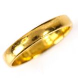 An early 20th century 22ct gold wedding band ring, maker's marks WW, hallmarks London 1901, band