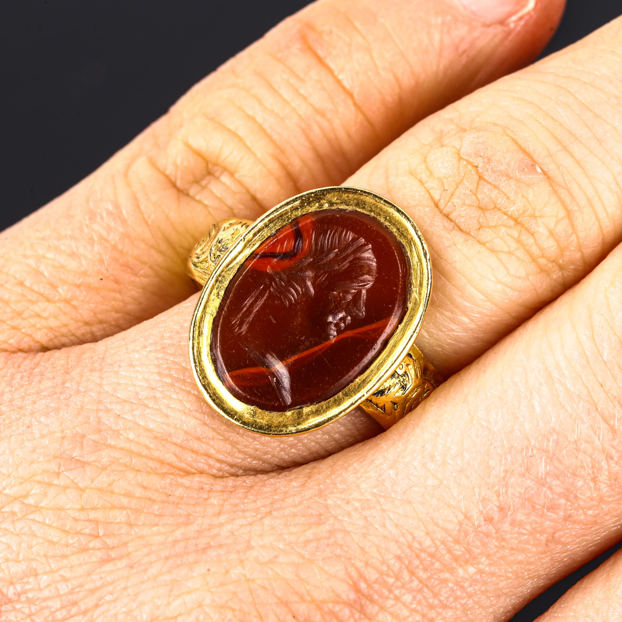 An Antique hardstone seal ring, heavy unmarked high carat gold settings, with intaglio carved male - Image 5 of 5