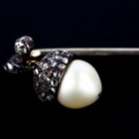 An early 20th century rose-cut diamond and pearl acorn stickpin, unmarked white metal settings