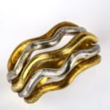 An 18ct yellow and white gold abstract band ring, wavy textures openwork design, setting height 14.