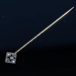 An Art Deco pearl and diamond stickpin, lozenge openwork form, set with single-cut diamonds,