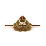 A 15ct gold and enamel Royal Naval Reserve (RNR) crest bar brooch, brooch length 50.8mm, 5.4g No
