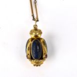 A large 18ct gold Etruscan Revival stone set bombe pendant necklace, set with oval cabochon lapis